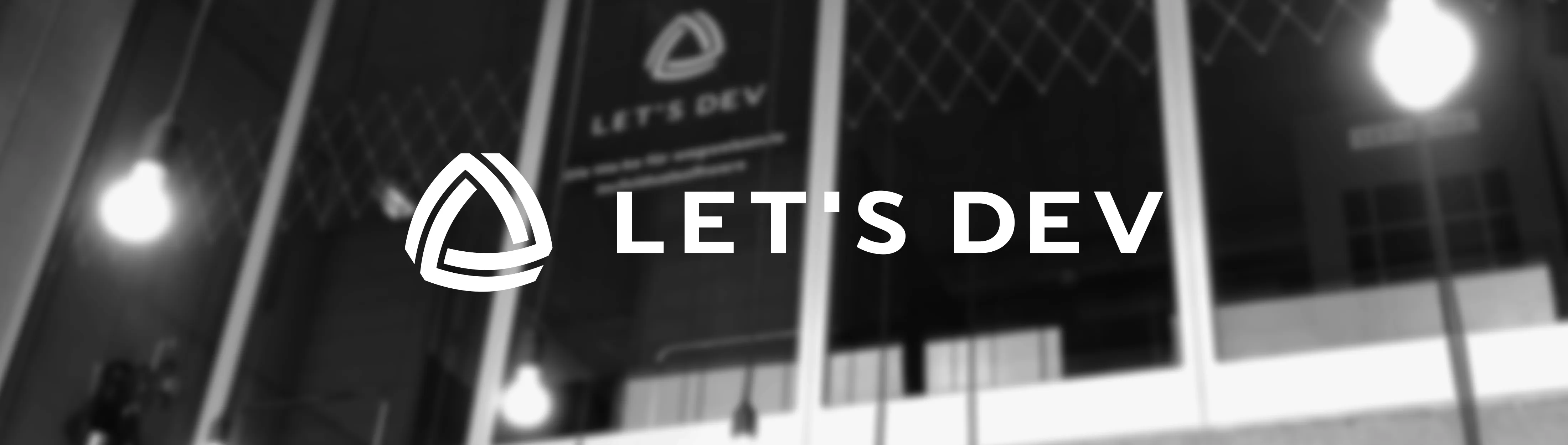 let’s dev logo on dark background representing custom software from Karlsruhe